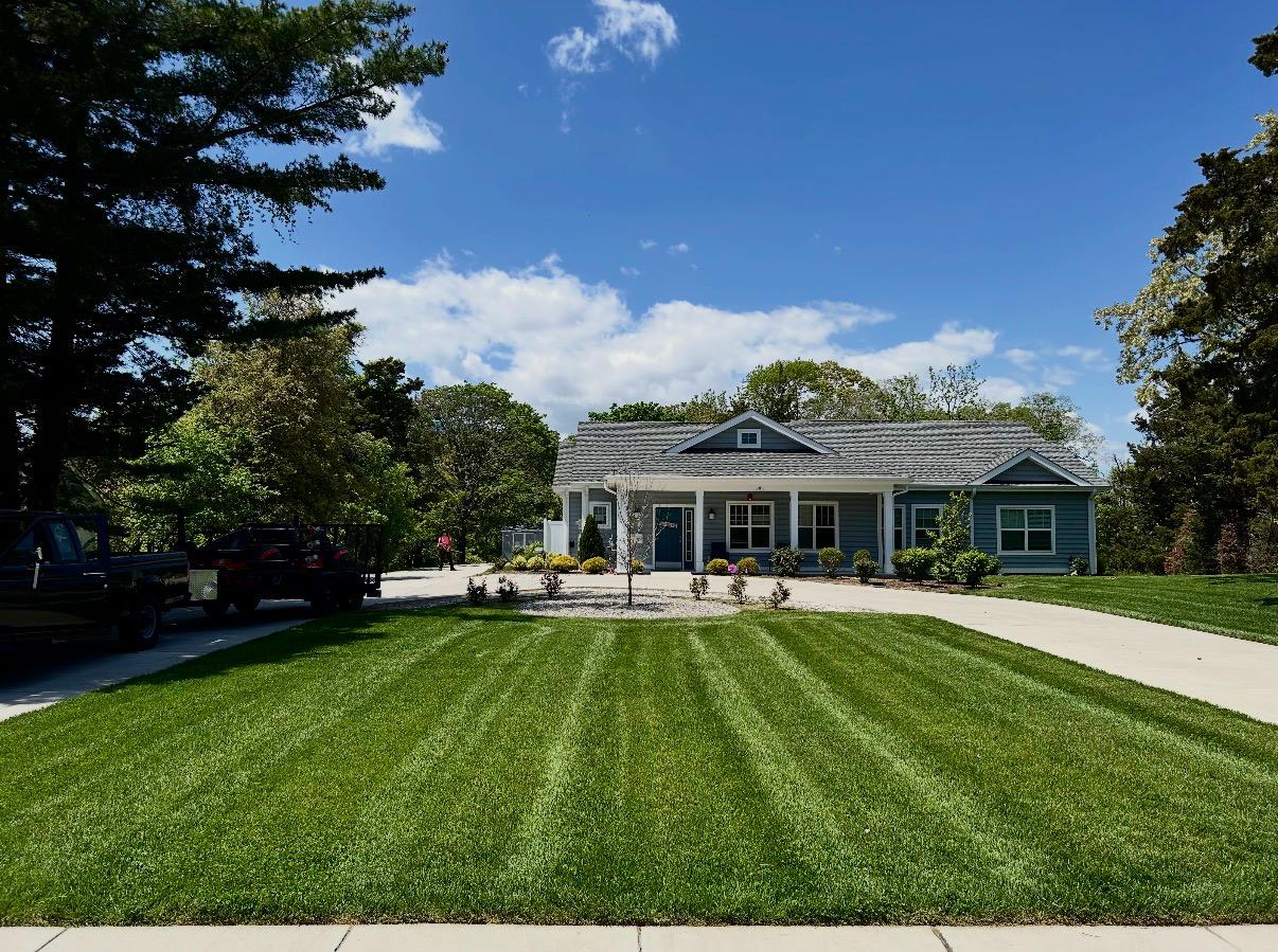 Recently completed Bult's Landscaping mow with sharp stripes in front of a Galloway Township, NJ home